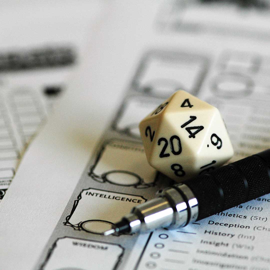 a d20 and mechanical pencil rest on character sheets